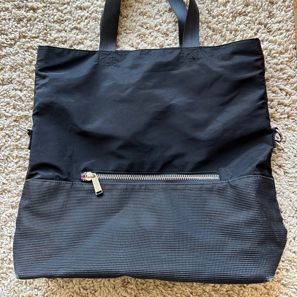 Athleta Tote Black and pink satin interior. Silver tone zippers.